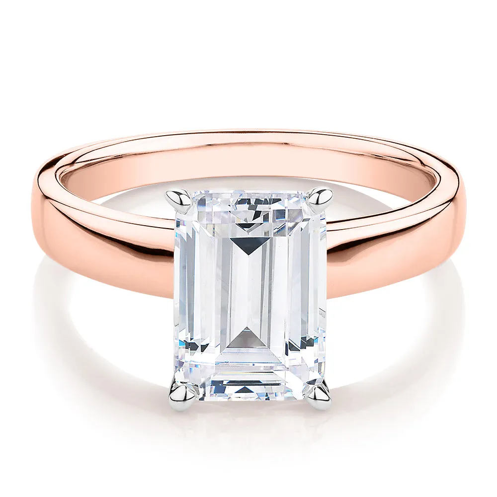 Emerald Cut solitaire engagement ring with 3.01 carat* diamond simulant in 14 carat rose and white gold