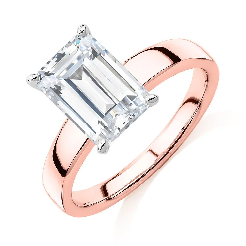 Emerald Cut solitaire engagement ring with 3.01 carat* diamond simulant in 14 carat rose and white gold