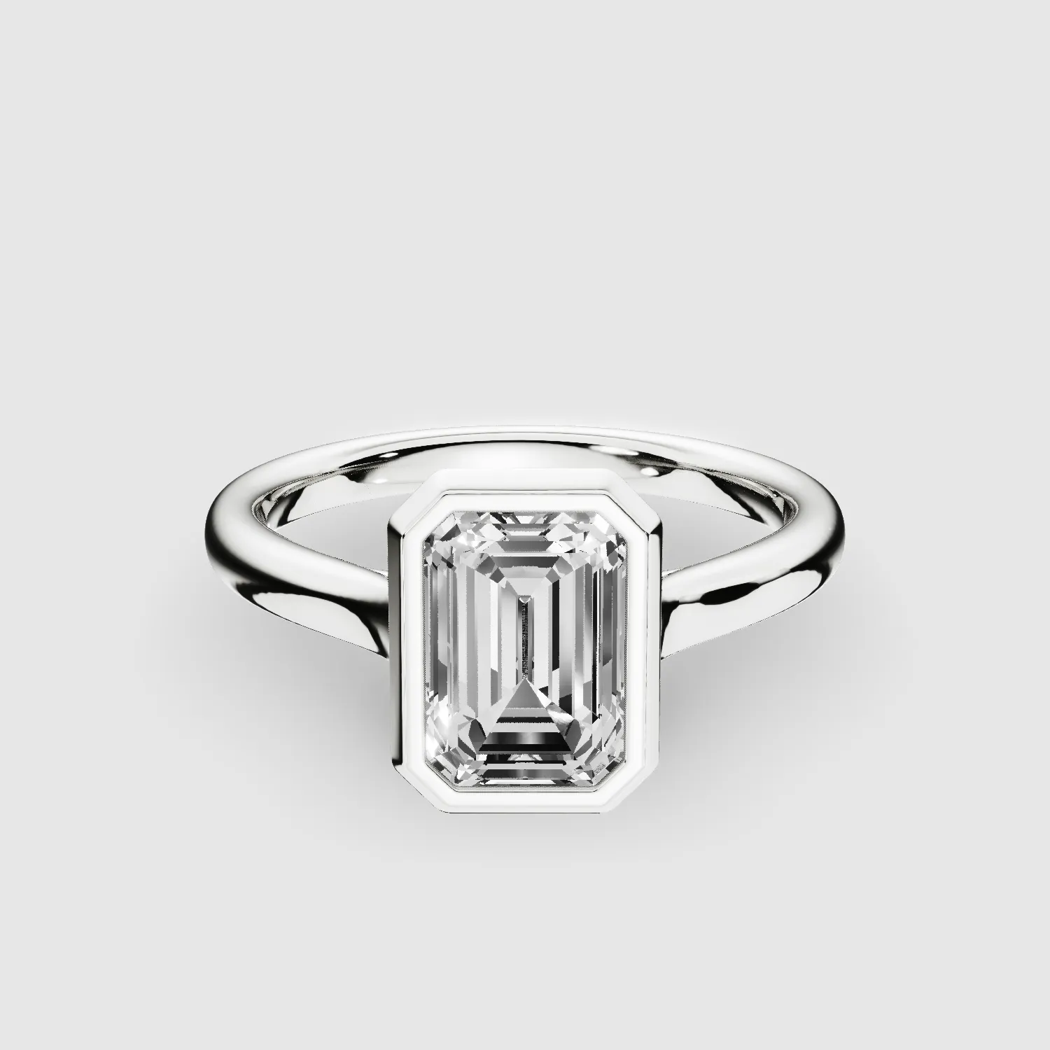 Slender Gold Shank Bezel Set Lab Grown Diamond Solitaire Ring with Cross Over Gallery-Emerald Cut
