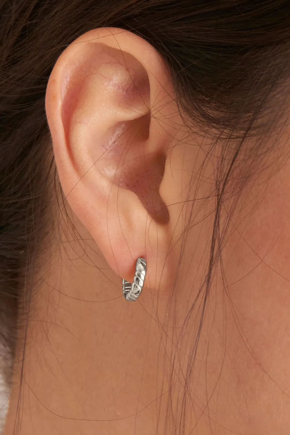 Smooth Operators Silver Twisted Huggie EOL Earrings